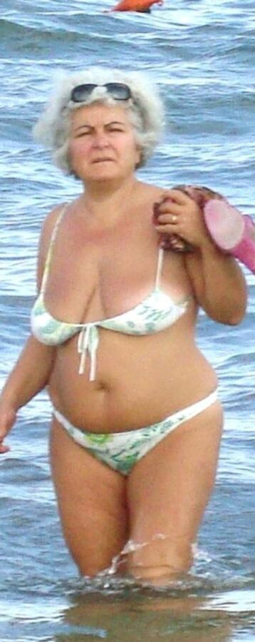 Granny in mini-bikini on the beach 6 of 10 pics