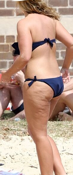 Fiona Falkiner shows off her curves in a tiny two piece at Beach 6 of 15 pics