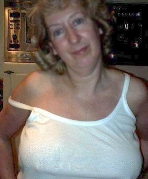 A BLONDE HAPPY MATURE WIFE 12 of 22 pics