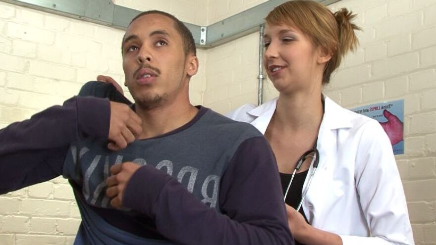 Female healthcare workers give body check to a asylum seeker for 1 of 12 pics