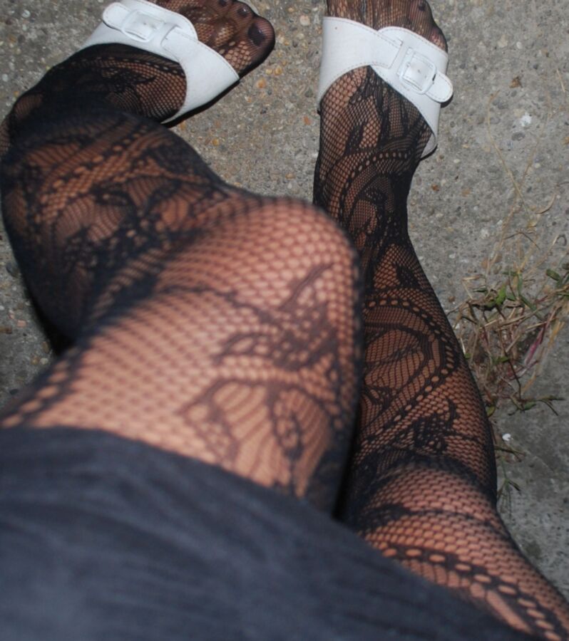 In black floral fishnets 9 of 20 pics