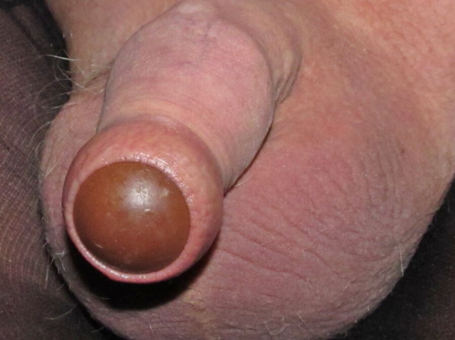 Chocolate candy under my foreskin, micro penis in pantyhose - Nuded Photo.