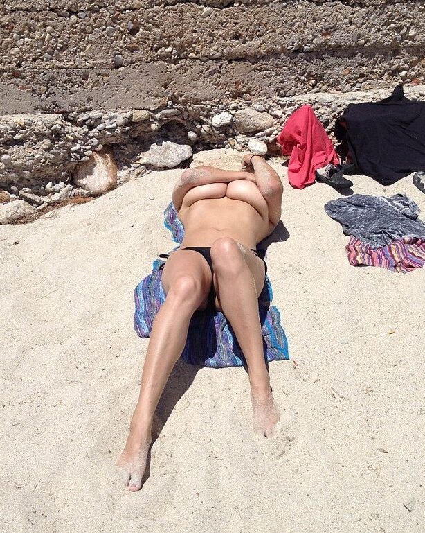 Topless sunbathing at the beach 7 of 12 pics