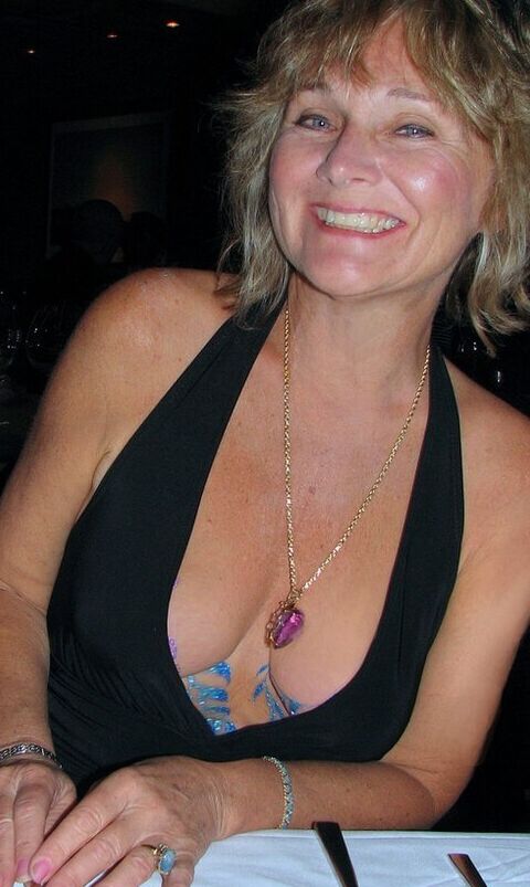 This mature blonde show us a bit her tits  1 of 11 pics