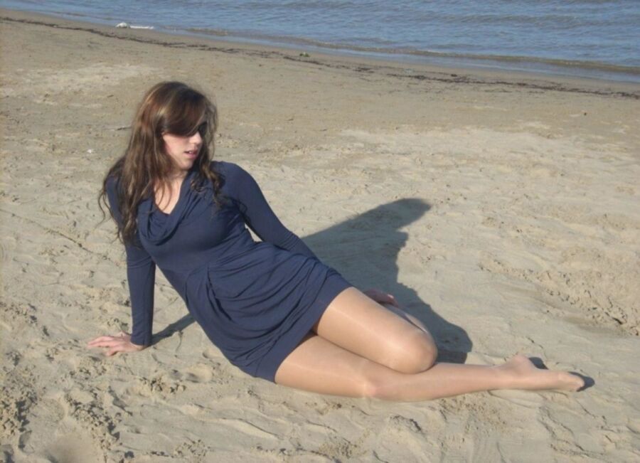 Picture of women wearing pantyhose/nylons/stockings/tights on the beach. 