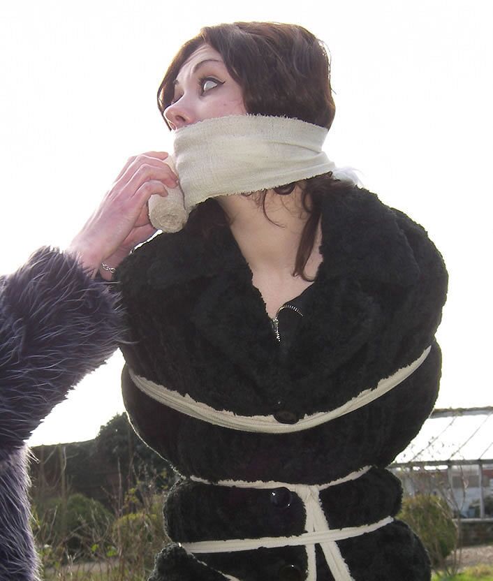 Dominatrix Bondage Slave Girl in Furs.