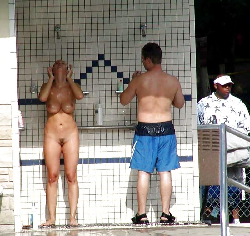Nude girl surprised men at public shower.