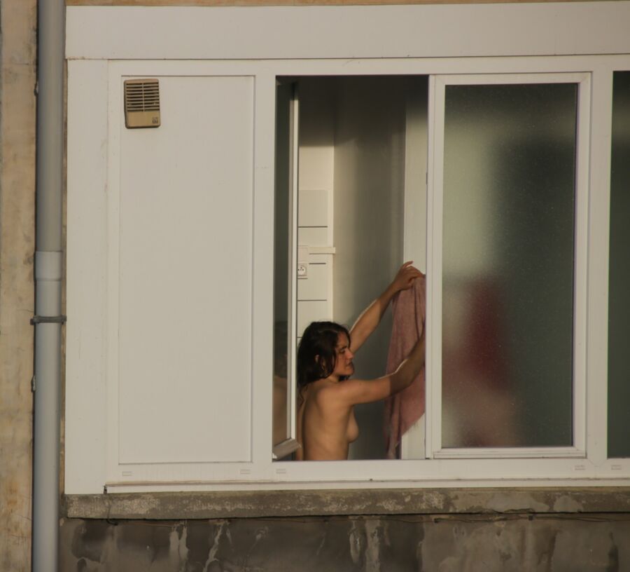 Voyeur : neighbour topless at the window.